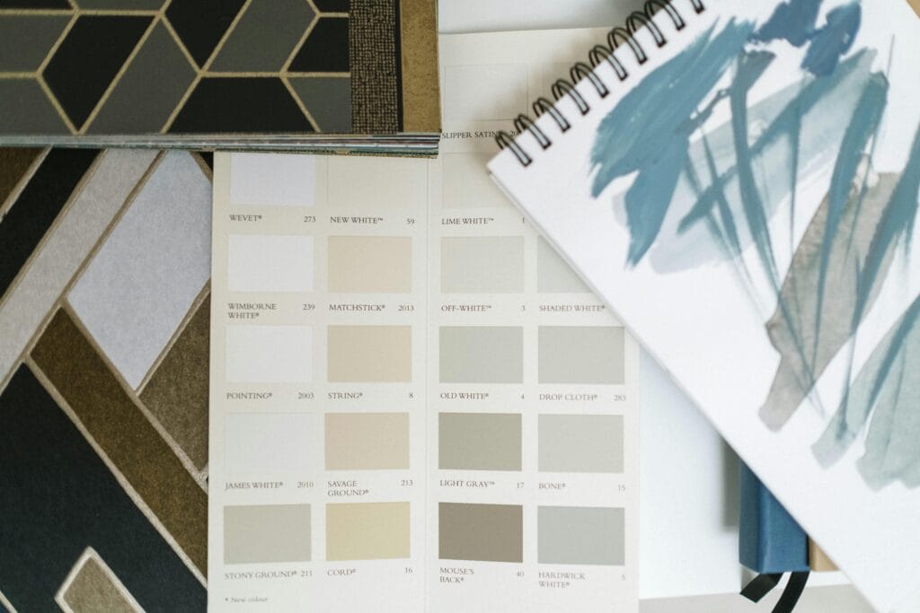pexels-photo-6579996-6579996 Top view of color swatches and design notebook showcasing elegant interior design elements.